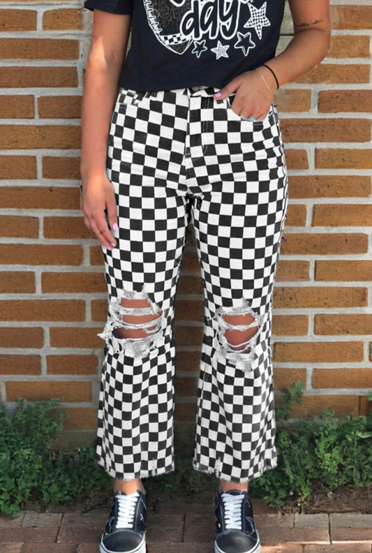 Black checkerboard print distressed holes raw edge cropped jeans